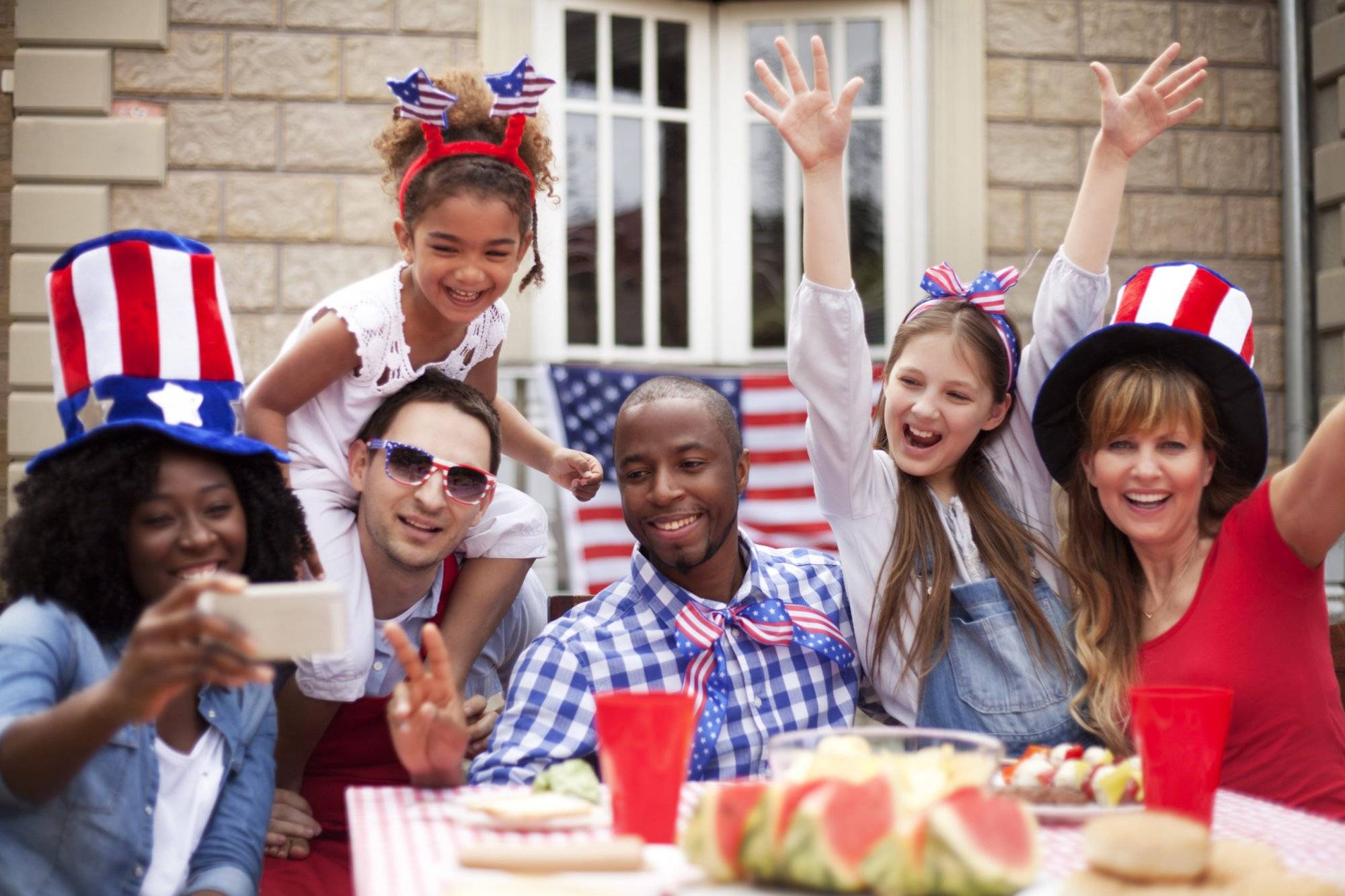 Two families happily celebrating Independence Day Two families happily celebrating Independence Day