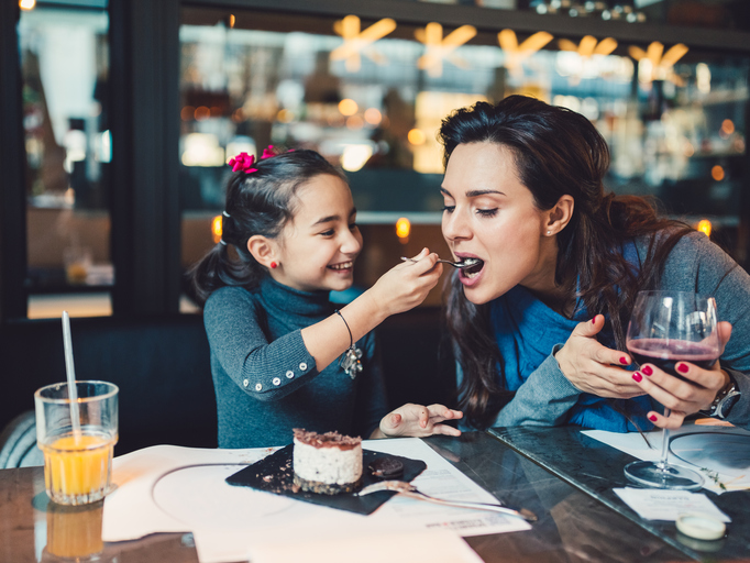 Mother and daughter in restaurant