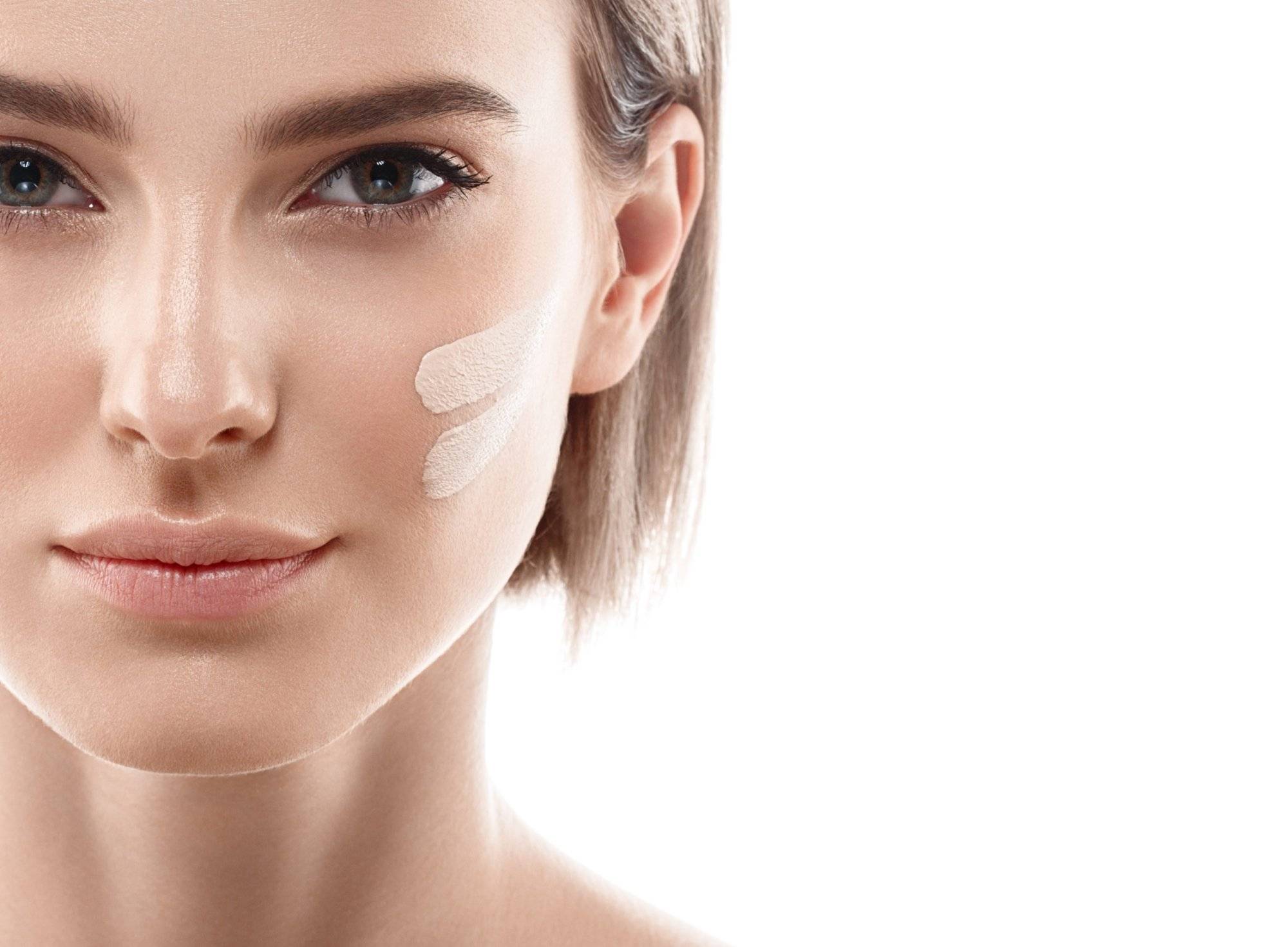 Perfect makeup. Skin tone cream lines on woman face. Perfect makeup. Skin tone cream lines on woman face.