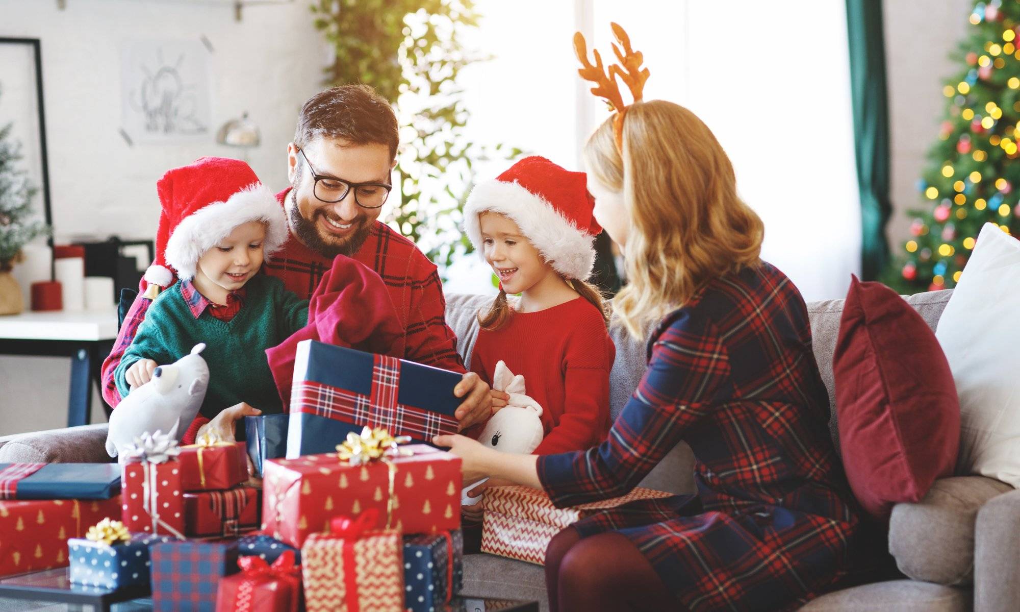 happy family open presents on Christmas morning Discover the Ultimate Christmas Gift Guide in Grapevine