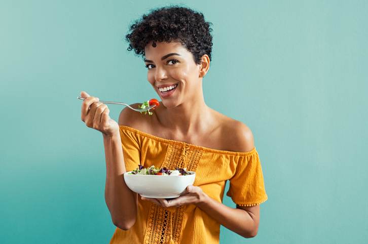 Woman eating salad Woman eating salad