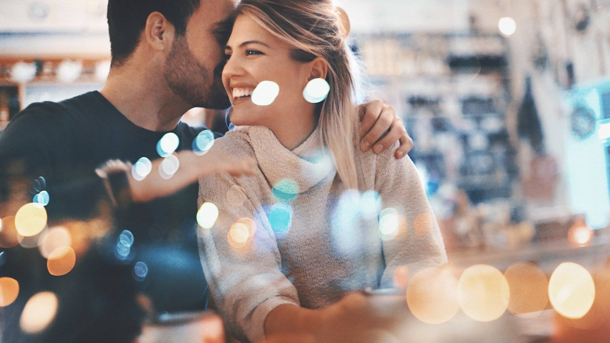 Couple on a romantic date at a coffee house.