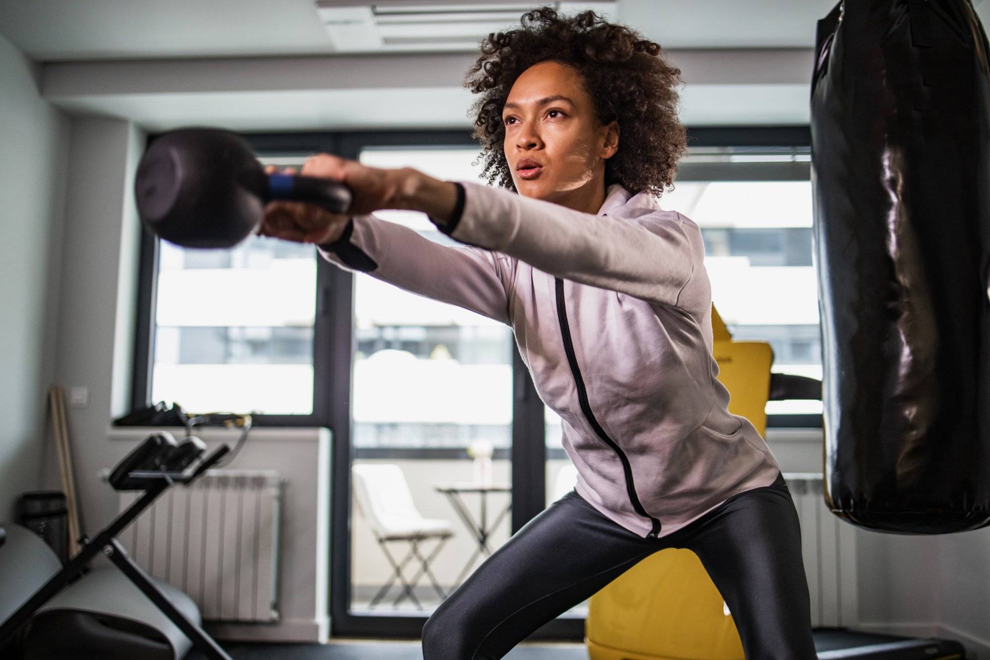 Woman doing weightlifting exercise Woman doing weightlifting exercise